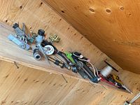 Shelf view of multiple sprinklers, connectors, spool and fittings