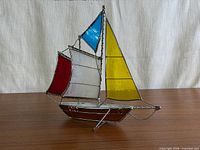 Full view of stained glass sailboat showing overall design and colours
