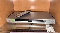Front view of Sony DVD/CD player with remote on top