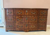 Front view of dresser showing overall design and nine drawers