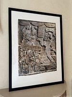 Full view of framed photographic print on wall