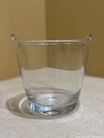 Front view of clear glass ice bucket showing shape and clarity
