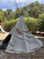 Full view of canvas teepee showing overall structure and condition