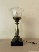 Full view of vintage metal and glass table lamp