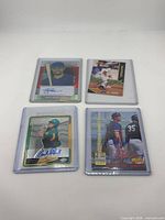 All four autographed rookie cards in toploaders