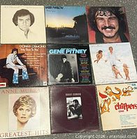 Nine LP records laid out 3x3 showing full front covers