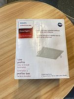 Front of sealed Philips Lightolier downlight box showing model FD4S07940TE1W and key specs