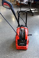 Front view of Snap-on pressure washer with hose and wand attached