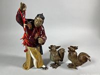 Group shot of porcelain figurine with both rooster figures