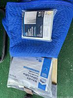 Blanket, mattress bag, tarp stacked