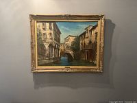 Full view of framed painting hung on wall