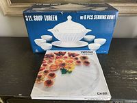 Boxes showing ceramic soup tureen set and Corning Centrix platter