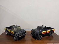 Both Tonka XR-101 trucks side by side on table
