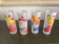 Front view of all four frosted fruit tumblers