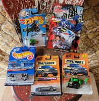 Group shot of all five sealed diecast vehicles on blister cards