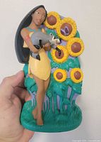 Front view showing Pocahontas, Meeko, sunflowers
