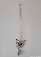 Full view of necklace hanging to show chain length and pendant size
