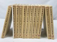 Spines of all 12 volumes standing in order