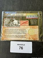 Coin sealed in display card with stamp inside plastic sleeve
