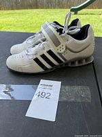 Side view of both shoes showing upper, heel construction and size tag area