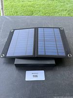 solar charger opened to show two panels and included power bank