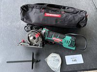 Full set showing saw, bag, blade, guide, hex key