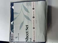 Front of packaged LuxClub full sheet set showing brand and features