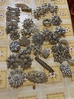 Full set of brooches laid out on table