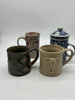 Group shot of the four ceramic mugs