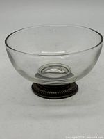 Side view of crystal bowl on sterling base