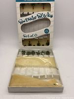 Front view of boxed Venezia Art Glass Collection swizzle sticks