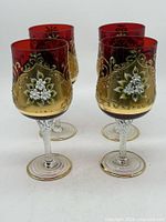 Four Murano wine glasses front angle