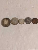 All five 1962 Canadian coins side by side