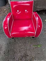 front view showing red vinyl, white piping, white button details