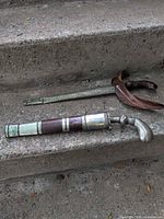 Both scabbards on concrete step