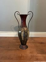 Full view of the ornate metal handled vase
