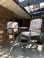 Table and two chairs on deck, overall view