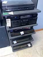 Front view of entire stereo stand with shelves occupied by electronics (electronics excluded)