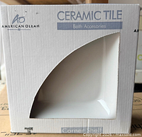 Front of boxed American Olean ceramic corner shelf