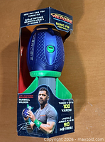 Front view of packaged Aerobie Sonic Fin Football showing product, colors and branding