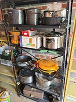 Overall shelf with assorted cookware and appliances