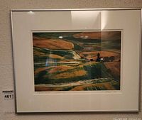 Full view of signed, dated color photograph in mat and silver frame