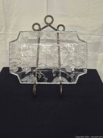 Full view of platter on stand showing overall shape and pattern