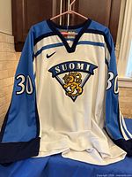 Front view showing crest, number 30 on sleeve, color scheme