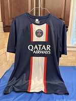 Full front view of PSG jersey showing color scheme and sponsor