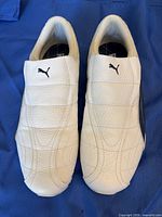 Top view showing overall condition, white uppers and navy logos