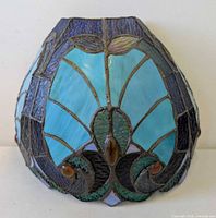 front view of stained glass wall sconce shade