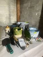 Group shot showing all planters, figurines and tools