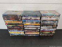 Two stacks of approximately 60 DVD cases
