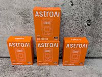 Four AstroAI AM330 multimeter boxes, three small one larger